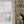 Pair of Cats wallpaper by Annika Reed in blue and cream, pairs of cats and vases in a hallway