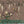 Birdsong By the Lake wallpaper by Dami and Em Design in brown, flat sample of birds and blossom by a lake