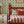 Flying Horse of the Silk Road wallpaper by Annika Reed in green and pink, flying horses in medallions in a bedroom