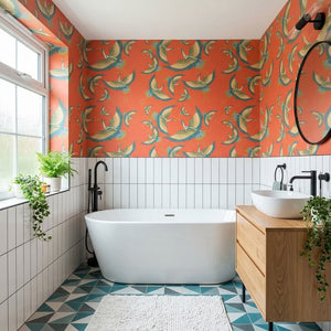 Pachamama wallpaper by Tatie Lou in coral, flying cranes on a bathroom wall