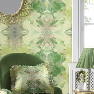 Amalfi wallpaper by Liberty James Studio in green and pink, a marbled kaleidoscope design in a living room