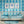 Bel Air Blossom wallpaper by Liberty James Studio in blue, a mirrored blossom design in a child's room
