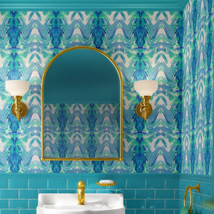 Bel Air Blossom wallpaper by Liberty James Studio in blue, a mirrored blossom design in a bathroom