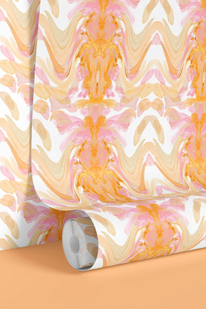 Bel Air Blossom wallpaper by Liberty James Studio in apricot, partly unrolled roll showing a mirrored blossom design