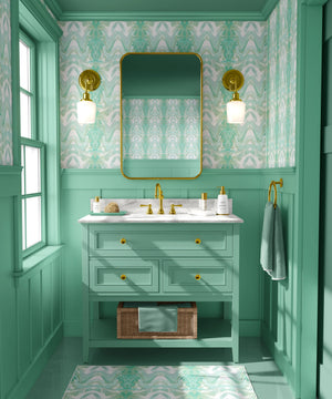 Bel Air Blossom wallpaper by Liberty James Studio in mint green, a mirrored blossom design in a bathroom