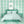 Bel Air Blossom wallpaper by Liberty James Studio in mint green, a mirrored blossom design behind a bed