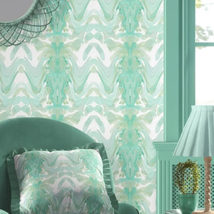 Bel Air Blossom wallpaper by Liberty James Studio in mint green, a mirrored blossom design in a living room