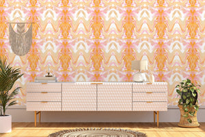 Bel Air Blossom wallpaper by Liberty James Studio in apricot, a mirrored blossom design above a sideboard