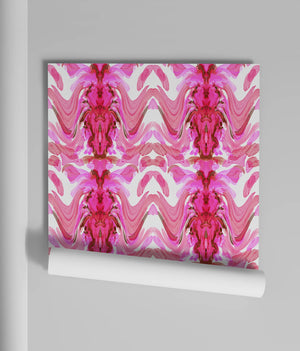 Bel Air Blossom wallpaper by Liberty James Studio in pink, partly unrolled roll showing a mirrored blossom design
