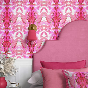 Bel Air Blossom wallpaper by Liberty James Studio in pink, a mirrored blossom design in a bedroom
