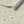 Caja Floral wallpaper by Seed Home Designs in green, roll showing line-drawn daisies