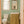 Dahlia wallpaper by Annika Reed in green, dahlia flowers in a bathroom