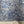 Ditzy wallpaper by House of Amitié in blue, roll showing fine hand-marbled pattern
