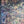 Serpentine wallpaper by House of Amitié in pink and blue, full repeat of peacock-feather marbling
