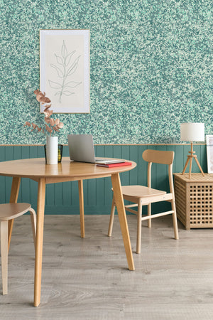 Ditzy wallpaper by House of Amitié in green, fine hand-marbled pattern in a dining area