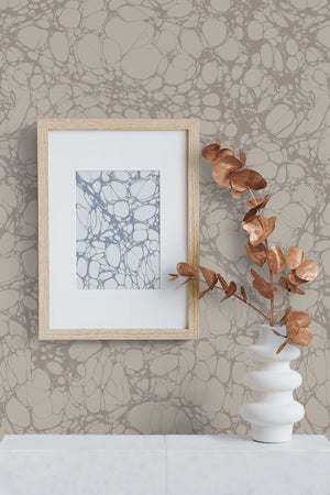 Moucheté wallpaper by House of Amitié in silver, soft marbled spots in a styled room setting