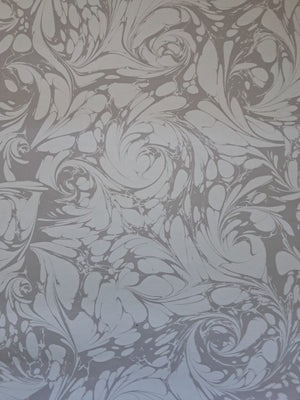 Flourish wallpaper by House of Amitié in silver, full repeat of flowing scrolls