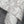 Flourish wallpaper by House of Amitié in silver, sample roll showing flowing scrolls
