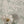 Flourish wallpaper by House of Amitié in green, flowing scrolls in a styled room setting