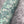Ditzy wallpaper by House of Amitié in green, roll showing fine hand-marbled pattern