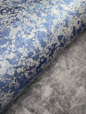 Ditzy wallpaper by House of Amitié in blue, full repeat of fine hand-marbled pattern