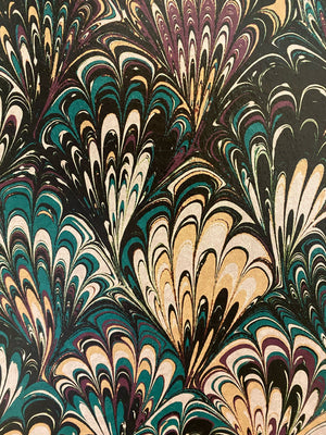 Serpentine wallpaper by House of Amitié in blue and black, pattern sample of peacock-feather marbling (alternate view)