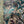 Serpentine wallpaper by House of Amitié in blue and black, flat sample of peacock-feather marbling