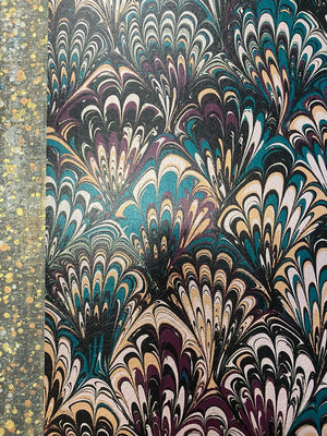 Serpentine wallpaper by House of Amitié in blue and black, flat sample of peacock-feather marbling