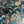 Serpentine wallpaper by House of Amitié in blue and black, pattern sample of peacock-feather marbling