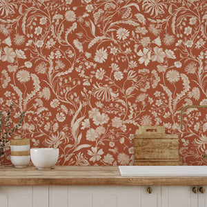 The Lost Garden Cottage wallpaper by Studio Le Cocq in blue, a dense garden of flowers above a sideboard