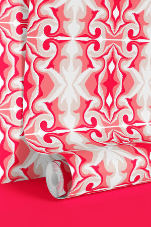 Marco Island wallpaper by Liberty James Studio in pink, partly unrolled roll showing a scrolling damask design