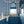 Marco Island wallpaper by Liberty James Studio in blue, a scrolling damask design on a bathroom wall