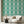 Marco Island wallpaper by Liberty James Studio in green, a scrolling damask design in a living room