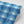 Motif wallpaper by Tatie Lou in blue, roll showing geometric pyramids