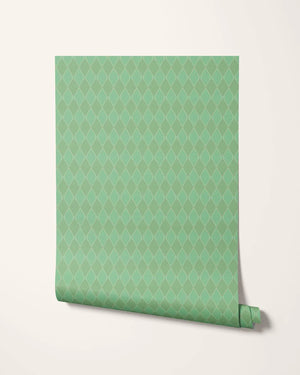 Harlequin Parade wallpaper by Annika Reed in green, partly unrolled roll showing a small harlequin check