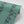 Passion Flower wallpaper by Tatie Lou in green, sample roll showing trailing passion flowers