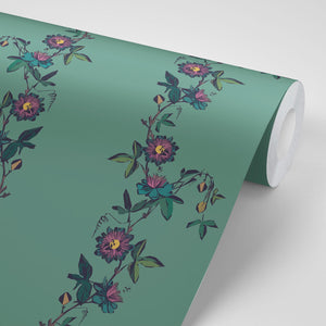 Passion Flower wallpaper by Tatie Lou in green, sample roll showing trailing passion flowers