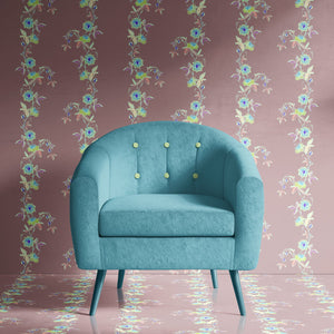 Passion Flower wallpaper by Tatie Lou in dusky pink, trailing passion flowers behind a sofa in a living room