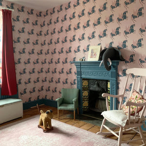 Pegasus wallpaper by Annika Reed in navy and pink, winged horses around a fireplace