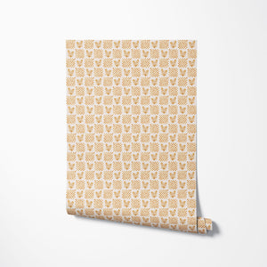 Picnic in the Flowers wallpaper by Studio Le Cocq in yellow, partly unrolled roll showing a small floral lattice