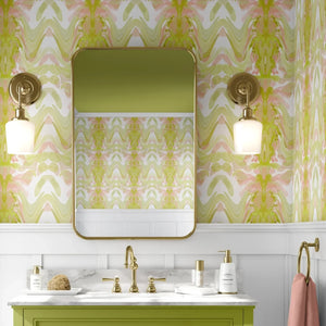 Bel Air Blossom wallpaper by Liberty James Studio in yellow-green, a mirrored blossom design on a bathroom wall