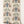 Pair of Cats wallpaper by Annika Reed in blue and cream, roll showing pairs of cats and vases