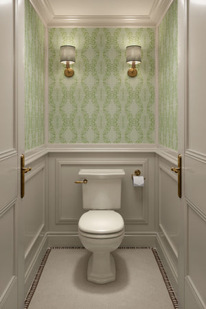 Clover Garden grasscloth by Dami and Em Design in light green, a trailing clover motif in a powder room