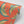 Pachamama wallpaper by Tatie Lou in coral, flat sample of flying cranes