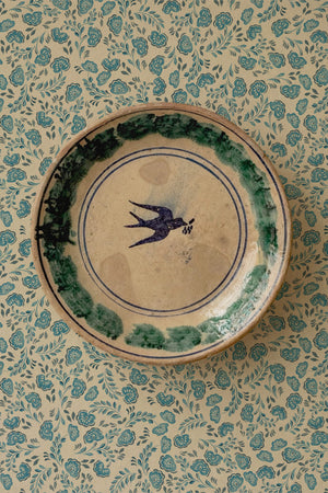 Annabelle wallpaper by Curate Space in teal, ditsy hand-painted florals in a room with a decorative bird plate