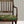 Etta wallpaper by Curate Space in navy, small floral sprigs behind a gilt chair with a green floral seat