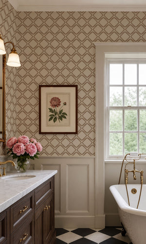 Florence wallpaper by Curate Space in rust orange, a leaf-lined diamond lattice in a bathroom with a freestanding bath and framed botanical print