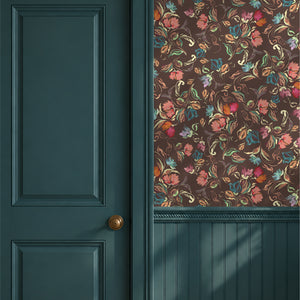 Freya wallpaper by Curate Space in brown, loose painterly flowers and leaves beside a deep green door