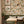 Iris wallpaper by Curate Space in off-white, botanical blooms and foliage in a kitchen dining nook with framed botanical prints