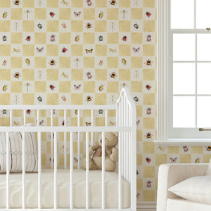 Jude wallpaper by Curate Space in butter yellow, insects on a soft check in a nursery with a white cot